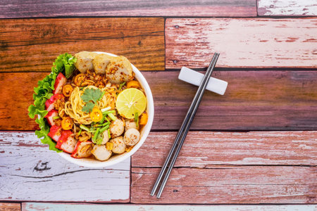 Tom yum noodles wooden background