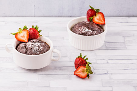 Brownie with strawberry fruit on wooden backgroundの写真素材