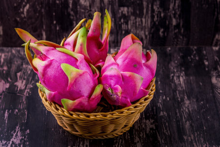Dragon fruit from Thailand Asia on dark wooden background