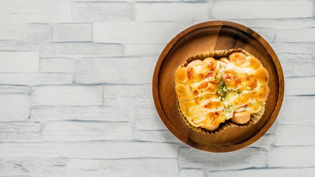 Bakery with sausage, breakfast on circle wooden plate