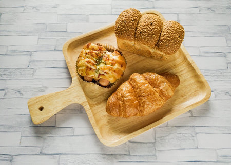 Bakery breakfast set on wooden plate