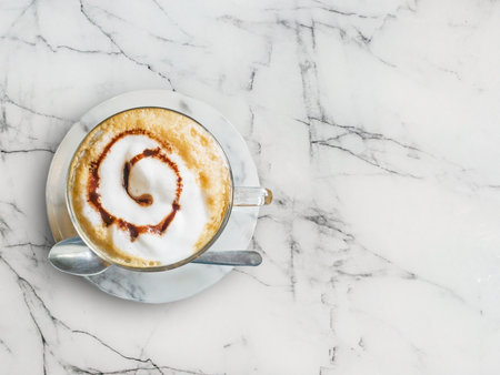 Hot mocha coffee with spoon on marble tableの写真素材