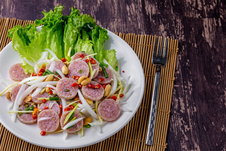 Fermented pork spicy tasty Thai street food on dark wooden tableの写真素材