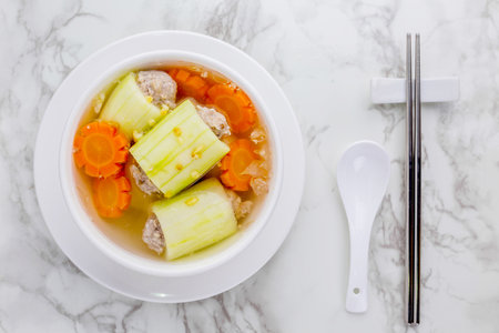 Stuffed cucumber soup tasty Thai food on marble tableの写真素材