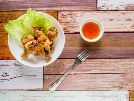 Fried chicken Thai food on wooden tableの写真素材