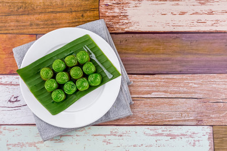 Layered candy Thai dessert rose shape on wooden tableの写真素材
