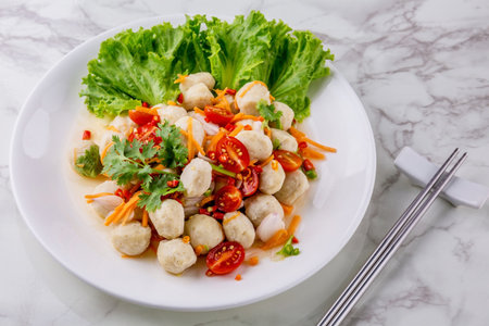 Pork ball spicy salad Thai food on marble tableの写真素材