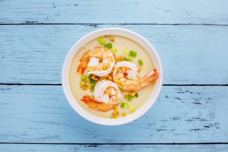 Steamed eggs with shrimp tasty asian cuisine on blue wooden backgroundの写真素材