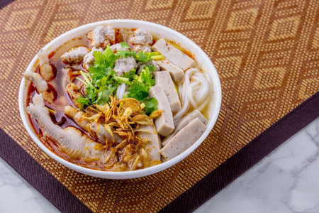 Vietnamese noodle soup with chicken feet Asian cuisine on marble background