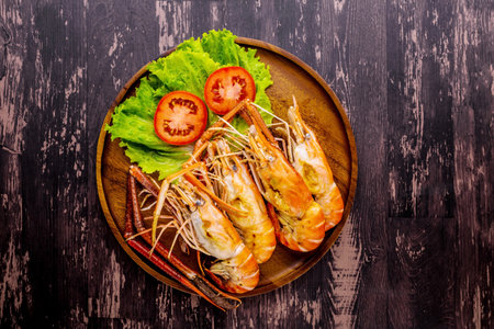 Baked shrimp tasty seafood on dark wooden backgroundの写真素材