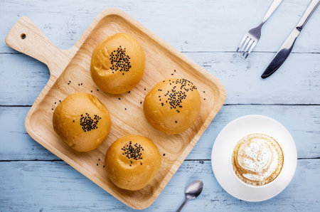 Red bean bread favorite bakery with coffee on blue wooden background
