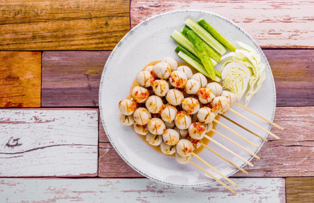 Grilled pork meatballs on dark wooden backgroundの写真素材