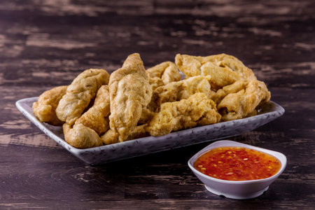 Fried fish balls on dark wooden backgroundの写真素材