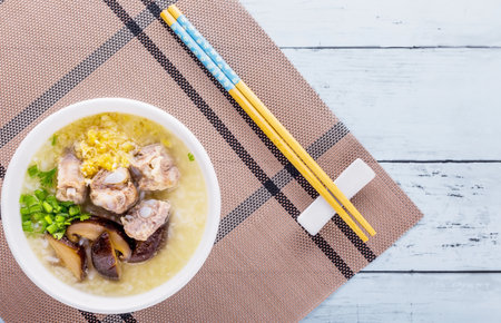 Pork bone boiled rice favorite cuisine on blue wooden background