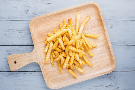 French fried favorite fast food on blue wooden backgroundの写真素材