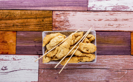 Fried fish balls on dark wooden backgroundの写真素材
