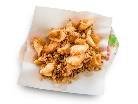 Fried squid with garlic isolated on white backgroundの写真素材