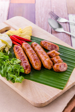 Thai sausage favorite street food on wooden table backgroundの写真素材