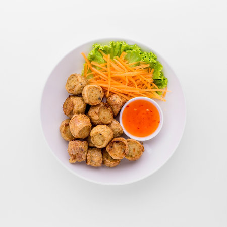 Deep fried crab meat rolls on white background