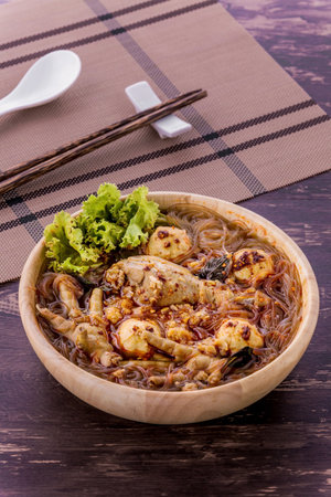 Vermicelli noodles with chicken tasty Asia food on wodden backgroundの写真素材