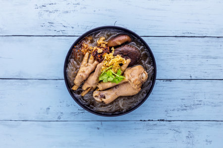 Vermicelli noodles with chicken tasty Asia food on blue backgroundの写真素材