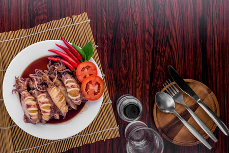 Sweet squid boiled on dark wooden background