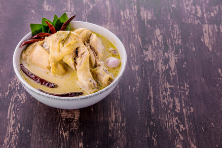 Thai chicken coconut soup on dark wooden backgroundの写真素材