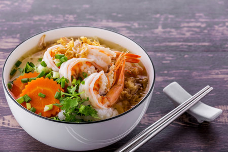 Rice porridge with shrimp on dark wooden backgroundの写真素材