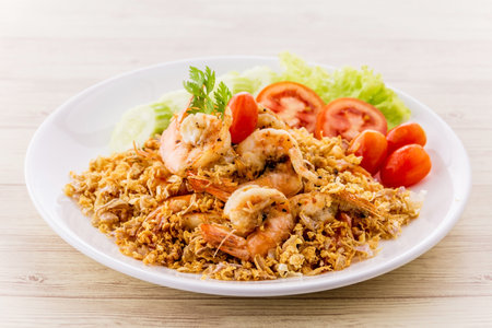 Fried shrimp with garlic and pepper on wooden backgroundの写真素材
