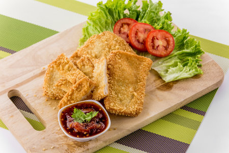 Breaded fish chips on white backgroundの写真素材