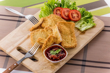 Breaded fish chips on white backgroundの写真素材