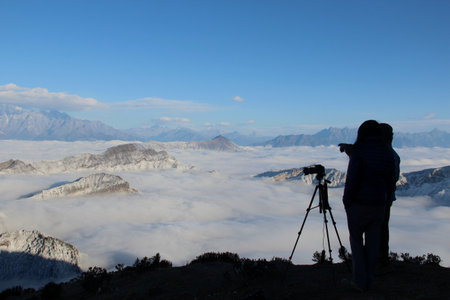 Silhouette of photographer at the mountainの写真素材