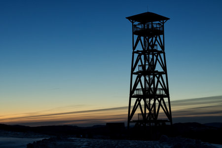 the silhouette of the EliÅ¡ka lookout tower in the cold morning dawn