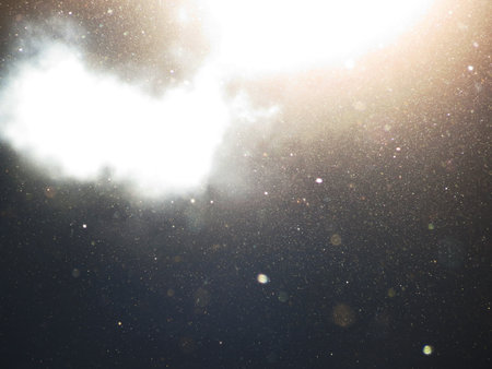 Abstract background with floating dust and garnish with translucent cloudsの写真素材