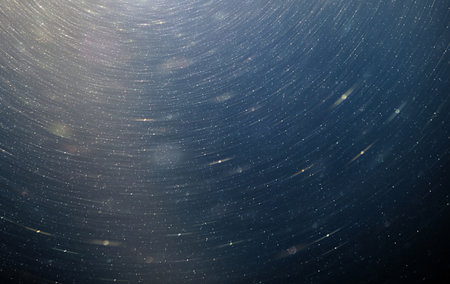 the Abstract blue blurred background with floating dustの写真素材