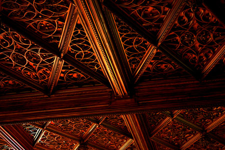 Carved wooden ornate symbols on the ceiling backgroundの写真素材