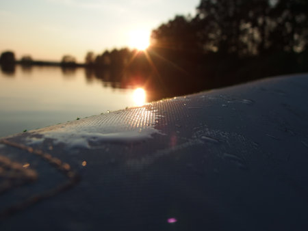 detail canoe on a pond at sunsetの写真素材