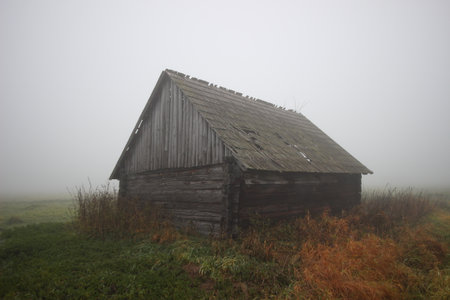 close up village building or old abandoned ruined brick house in mistの写真素材