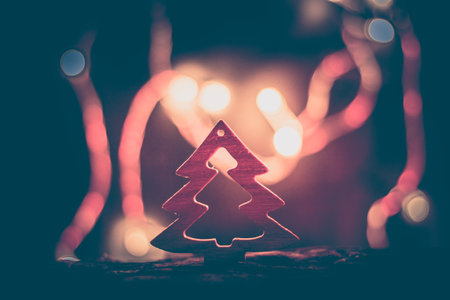 christmas background with handmade Christmas tree, blurry background with christmas lightsの写真素材