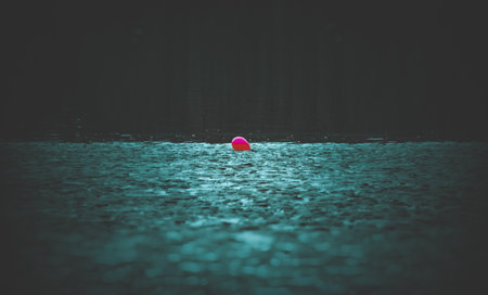 the red balloon in the middle of a dark mudの写真素材