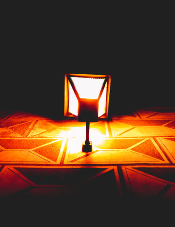 dark night street, yellow lighting from lantern, sgraffito on the wallの写真素材