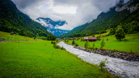 A beautiful scenery with a narrow river in Switzerlandの写真素材