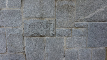 An irregular stone pattern background on the wallの写真素材