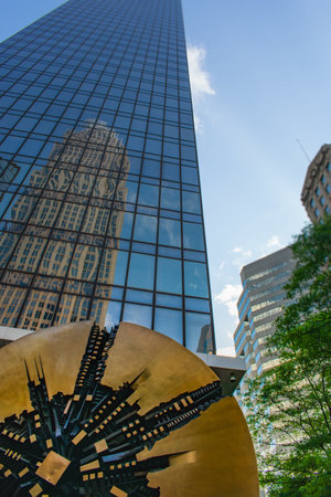Charlotte NC/USA- 05 23 2020: The Grande Disco Status Is Locaded at Bank of America Plaza.?The reflecting in the building is a Charlotte's tallest building "Bank of america tower".のeditorial素材
