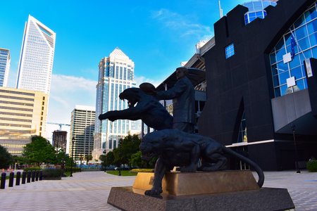 Charlotte NC/USA-May 09,2020:The Jerry Richardson Statue That Was Distributed Outside of the Carolina Pantsers, Bank of America Stadium Was Removed. Bank of America Building Can Be Seen the Status.のeditorial素材