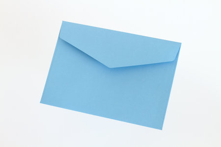 Blue envelope on white backgroundの写真素材