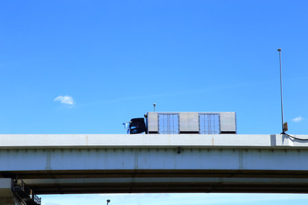 Truck driving on Metropolitan Expresswayの写真素材