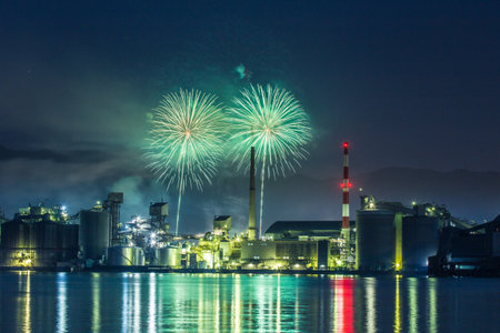 Factory night view and fireworks in Tsukumi City, Oita Prefectureの写真素材