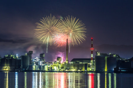 Factory night view and fireworks in Tsukumi City, Oita Prefectureの写真素材