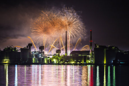 Factory night view and fireworks in Tsukumi City, Oita Prefectureの写真素材